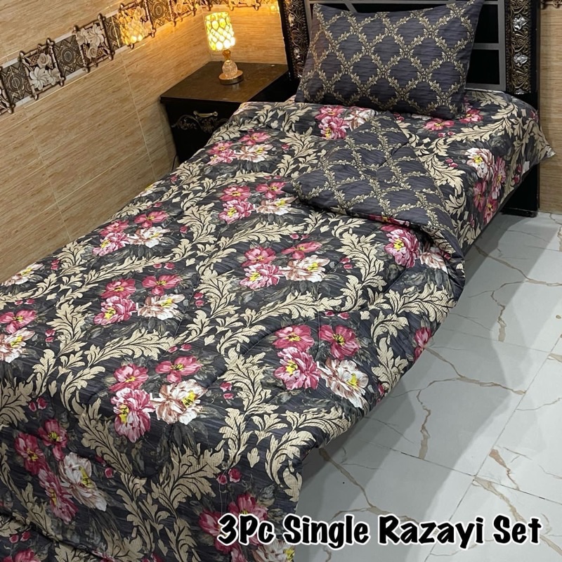 Stylish Single Size Vicky Razai Set with printed quilt, soft cotton bedsheet, and pillow cover for single bed comfort and vibrant décor.